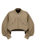 Veste courte beige à manches bouffantes